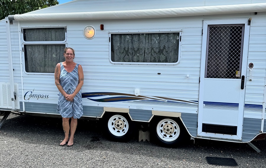 Clair standing outside her new caravan in Tara