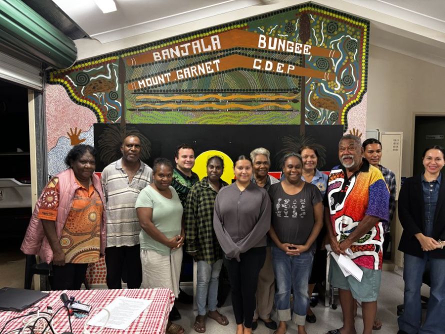 Group photo of 12 First Nations people standing next to each other at First Nations Home Ownership Information Session held in Mount Garnet. 