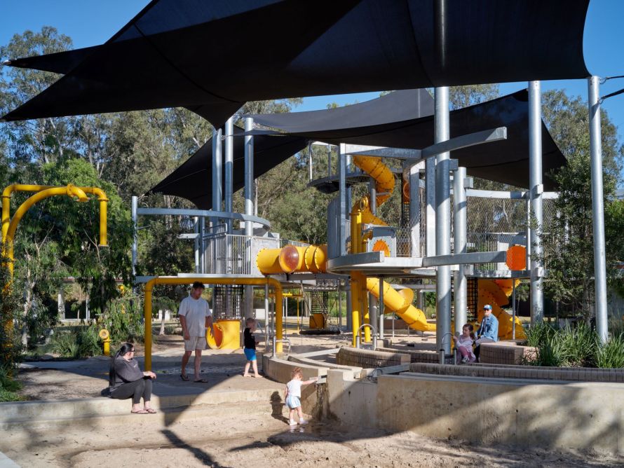 Children playing on playground equipment.