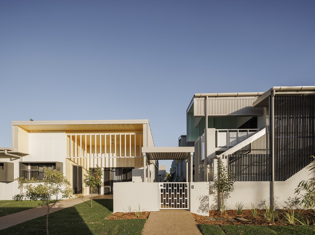 View to 1 of the larger dwellings in the development, also showing a pedestrian gate and stairway to the upper level.